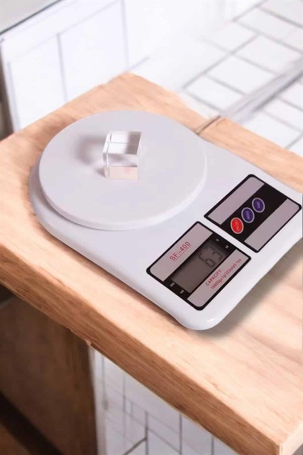 1214077_kompakt-tasarim-ve-tek-tusla-sifirlama-8-d2d4.jpg Kompakt Tasarım ve Tek Tuşla Sıfırlama Özelliğiyle Kullanımı Kolay Mutfak Tartısı - Görsel 1